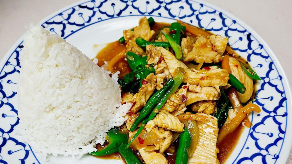 Pad Kra Pao · Hot. Sauteed with basil leaves, onions, mushrooms and bell peppers in hot and spicy chili sauce.