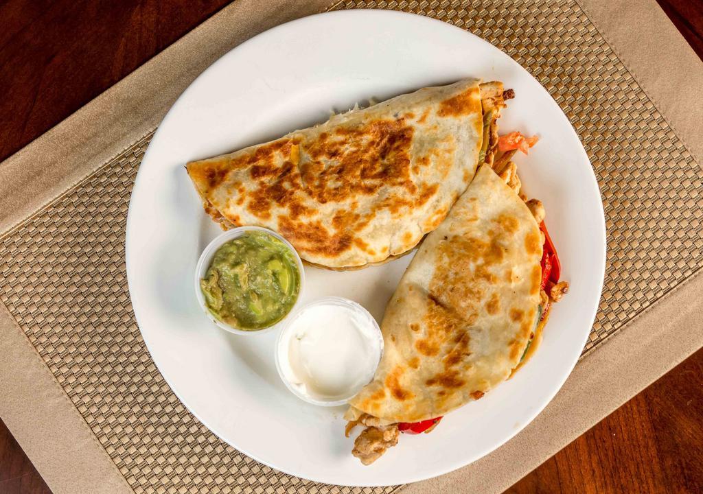 Fajita Quesadilla · Two quesadillas with tender beef or chicken, grilled onion, bell pepper, guacamole and sour cream.