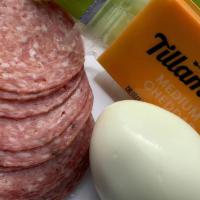Protein Pack · Hard boiled egg, dry wine salami, English cucumbers and a Tillamook cheddar cheese square.