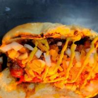 Chili Cheese Dog · A chili drenched dog with melted Cheddar, diced onions and mustard.