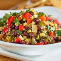 Texas Caviar · Gluten-free. Black beans, garbanzo beans, tomatoes, red onions, red bell peppers, pickled ja...