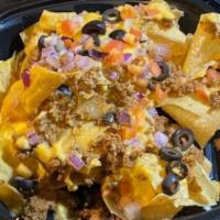 Ot Nachos Supreme · Fresh homemade tortilla chips stacked to a ridiculous level and smothered with seasoned beef...