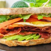 Breakfast Blt · Crispy bacon, juicy tomato slices, sliced avocado and organic arugula. Topped with an over m...