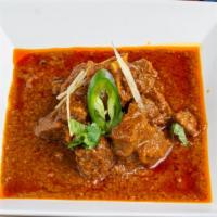 Bhuna Gosht Punjabi (Goat Curry) · Goat meat cooked in hot and spicy gravy.