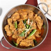 Chicken Karahi (For 2) · Small pieces of chicken cooked with tomatoes in olive oil.