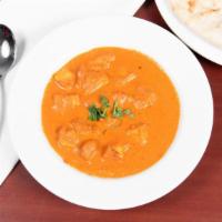 Butter Chicken · Boneless chicken chunks cooked in tandoor and mixed with mild tomato based sauce with almond...