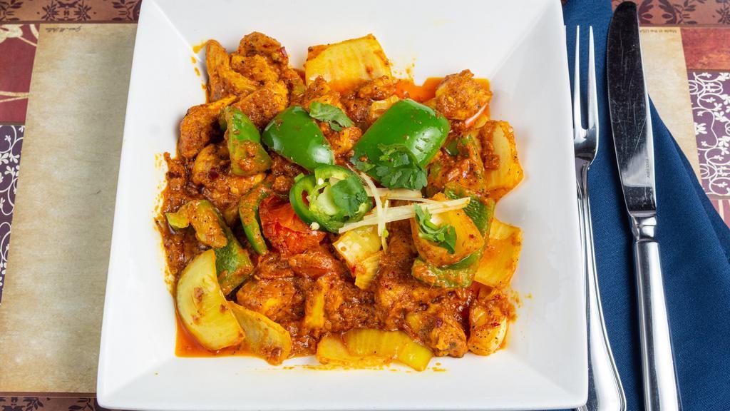 Chicken Jelfrezi · Chunks of boneless chicken cooked in onion, tomatoes and green peppers.