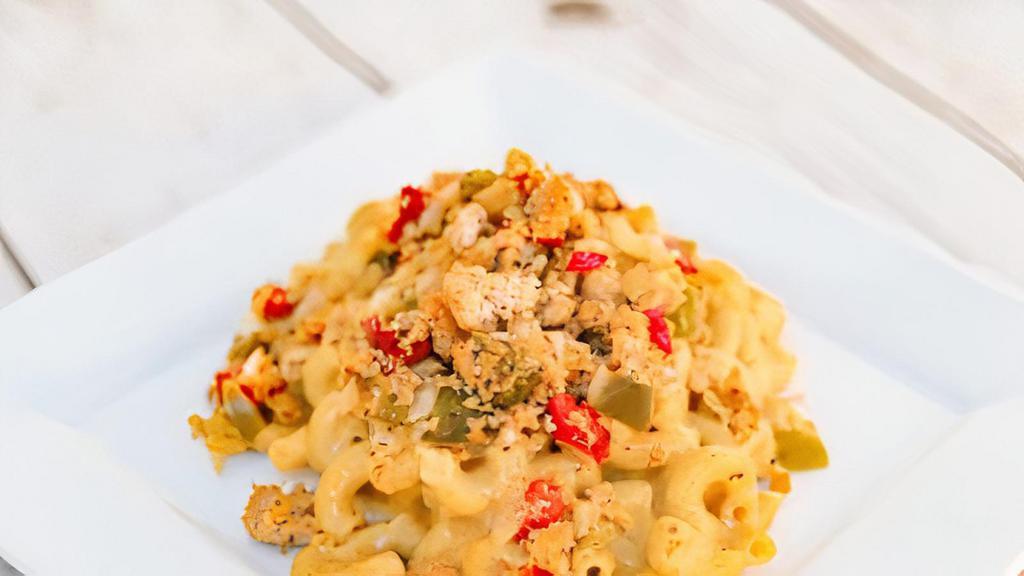 Taco Mac & Cheese · Whole wheat pasta tossed in a creamy pepper jack cheese sauce with ground turkey, red and green bell peppers, onion, and jalapeños.