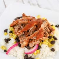 Pork Carnitas Bowl · A grilled whole wheat tortilla layered with southwest chicken, roasted corn, black beans, re...