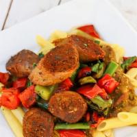 Sausage Penne Pasta · Vegan Option: Pea-protein based pasta paired with cajun spiced plant based sausage, baby spi...