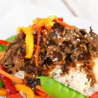 Shaved Steak Stir Fry · Jasmine rice, topped with slow-braised shaved beef served with our house sesame stir-fry sau...