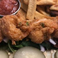 Shrimp Po Boy · Fresh oysters lightly battered and flash fried. Served on a sub roll with lettuce, pickles a...