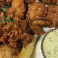 Fried Oysters · Fresh jumbo oysters tossed in seasoned flour and fried to perfection. Served with jalapeño s...