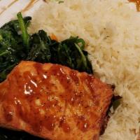 Teriyaki Glazed Salmon · Pan seared Scottish salmon served with spinach, captain's rice and glazed with teriyaki sauc...