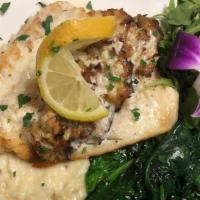 Crab Crusted Rockfish · Fresh rockfish sautéed, topped with jumbo crab meat, served with mash potatoes and spinach f...
