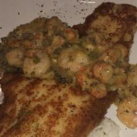 Catfish Mary · Panko-crusted Mississippi farm-raised catfish filet, topped with mary sauce, served over ric...