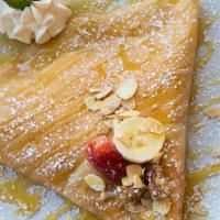Allison'S Parfait · vanilla low fat yogurt, bananas, strawberries, granola, toasted almonds, & a drizzle of honey