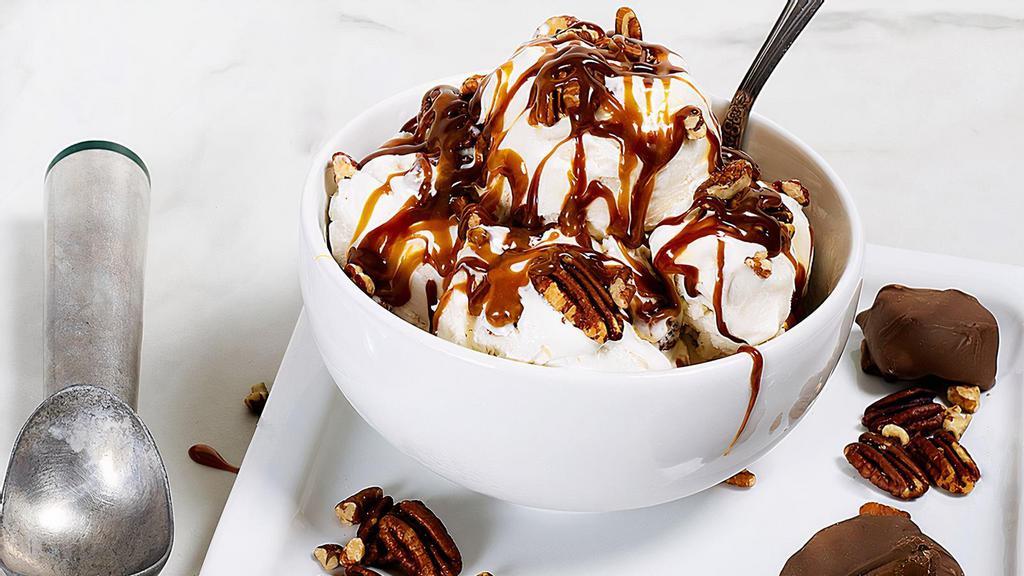 Pecan Titan · Ice cream covered with hot fudge and classic caramel topping with pecans