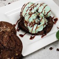 Cookie A La Mode  · A fresh baked cookie, served a la mode with dessert topping