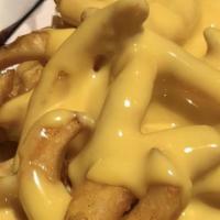 Cheese Fries · Thin crinkle cut fries topped with warm kraft cheese whiz.