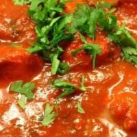 Chicken Vindaloo · Curried chicken cooked with fresh ginger, garlic and potatoes in a fiery sauce, spicy..