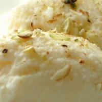 Rasmalai · Soft velvety patties of cheese soaked in rose flavored milky syrup with pistachios.