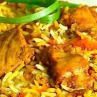 Chicken Biryani · Basmati rice with chicken, richly flavored with nuts and raisins with aromatic masala.