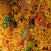 Biryani · Basmati rice with vegetable, richly flavored with nuts and raisins with aromatic masala.