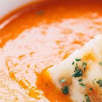 Tomato Soup · Cream of tomatoes with herbs and spices.