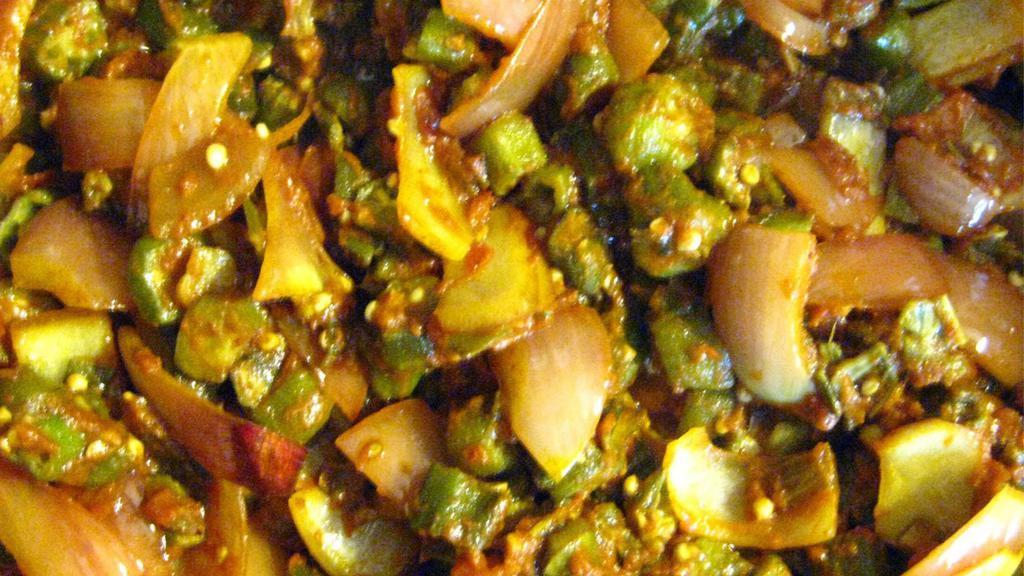 Bhindi Masala · Lightly spiced cut okra simmered with diced onions and tomatoes.