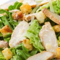 Caesar Salad · Crisp romaine tossed with croutons, tomatoes, olives, Caesar dressing, and grated Parmesan c...