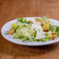 Caesar Salad · Romaine lettuce topped with croutons, parmesan cheese, served with caesar dressing.