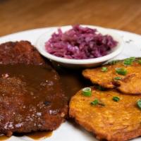 Schnitzel · Your choice of breaded pork cutlet, or breaded chicken served with two potato pancakes and a...
