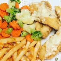 Perch Dinner · Fresh lake perch topped with lemon beurre blanc sauce and served with french fries and a veg...