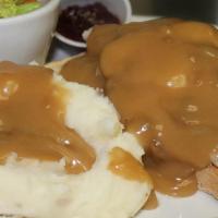 Hot Turkey Sandwich · Open-faced grilled sourdough topped with turkey and gravy served with mashed potatoes and ve...