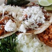 Tacos Rancheros · Two tacos in corn tortilla with asada, frijoles charos on top and queso fresco. Served with ...