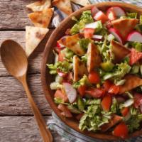 Fattoush Salad · Fresh romaine lettuce, tomatoes, cucumbers, radishes, onions, parsley and authentic spices a...