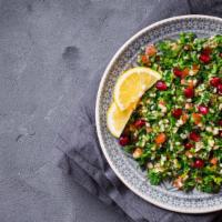 Tabbouleh Salad · Fresh finely hand chopped parsley, green onions, tomatoes, wheat crackers, lemon juice, oliv...