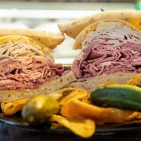 The Mel Sandwich · 3/4lb (total) of Corned beef, fresh turkey breast, Swiss cheese, coleslaw and Russian dressi...