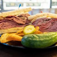The Spielberg Sandwich · Corned beef, pastrami, tongue, Swiss cheese, cole slaw and Russian dressing served on your c...