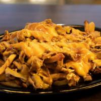 Brisket French Fries · BBQ sauce, fried onions and Cheddar cheese.