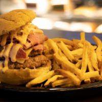 Reuben Burger · Half pound hamburger topped with your choice of Reuben served on grilled rye.