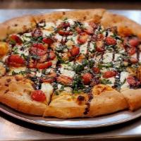 Margherita Pizza · grape tomato, fresh mozzarella, sweet basil