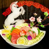 Sashimi Deluxe · 16 pcs assorted raw fish with rice.