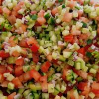 Shirazi Salad · Cucumber, tomatoes, onions parsley. Dressing.