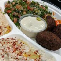 Veggie Plate · Served with Hummus, Baba Ganoush, Falafel, Grape leaves, Salad and pita bread.