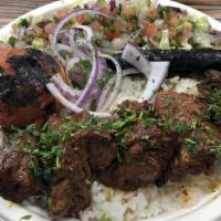 Beef Kabob · Served with Rice, Hummus, Salad Grilled Tomato, Grilled Jalapeño, onions. Pita Bread.