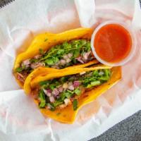 Brisket Street Tacos · Served on corn tortillas, smoked brisket, cilantro, onion and habanero salsa.