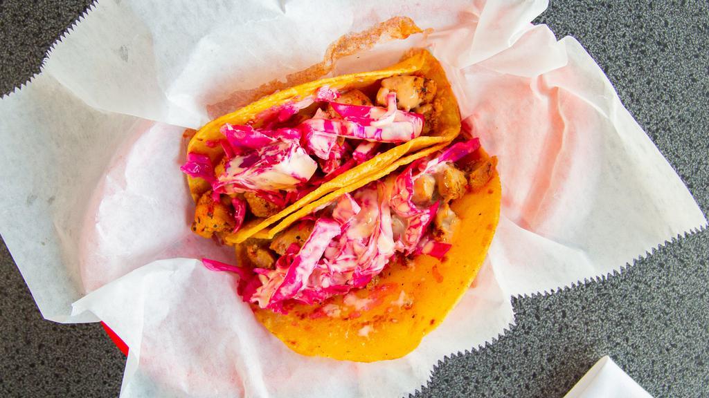Honey Sriracha Street Tacos · Served on corn tortillas, honey sriracha chicken, purple pickled cabbage, topped with our house sriracha sauce.