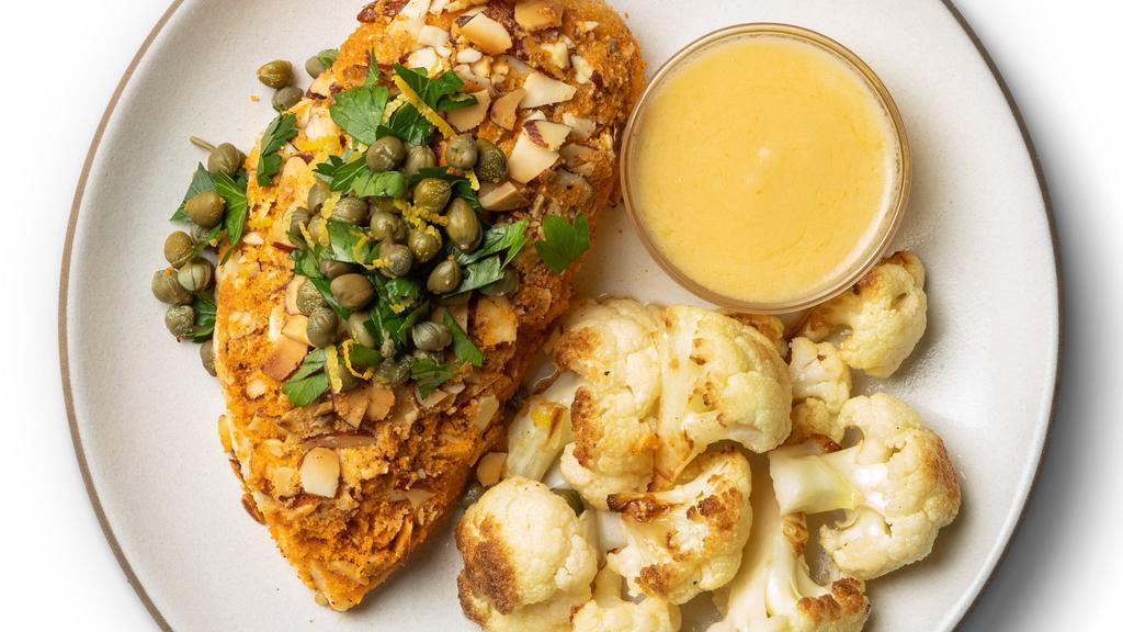 Chicken Piccata · Paleo, whole30, keto, and gluten-free. Keto-friendly “breaded” chicken is topped with our lemon caper sauce. Served with squash and leafy greens.